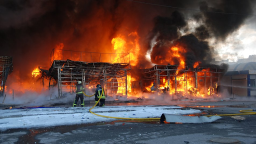 A fire at the market in the Heroiv Pratsi on March 16, 2022. (Image posted by Suspilne News)