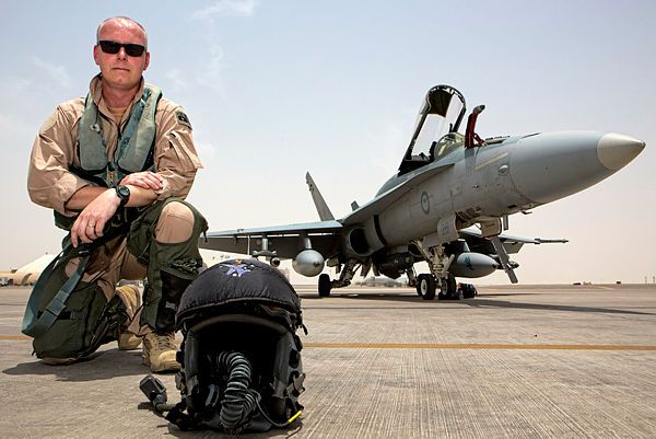 Commander Air Task Group, Air Commodore Philip Gordon, in front of an F/A-18A Hornet on the flight line of Australia's main air operating base in the Middle East region. (Aus MoD)