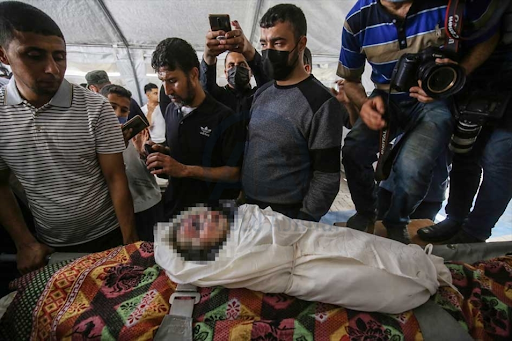 Body of the child identified as Ibrahim Al-Rantissi who was killed in strikes on Al Jeniya neighborhood on May 13, 2021. (Image posted by Anadolu Agency)