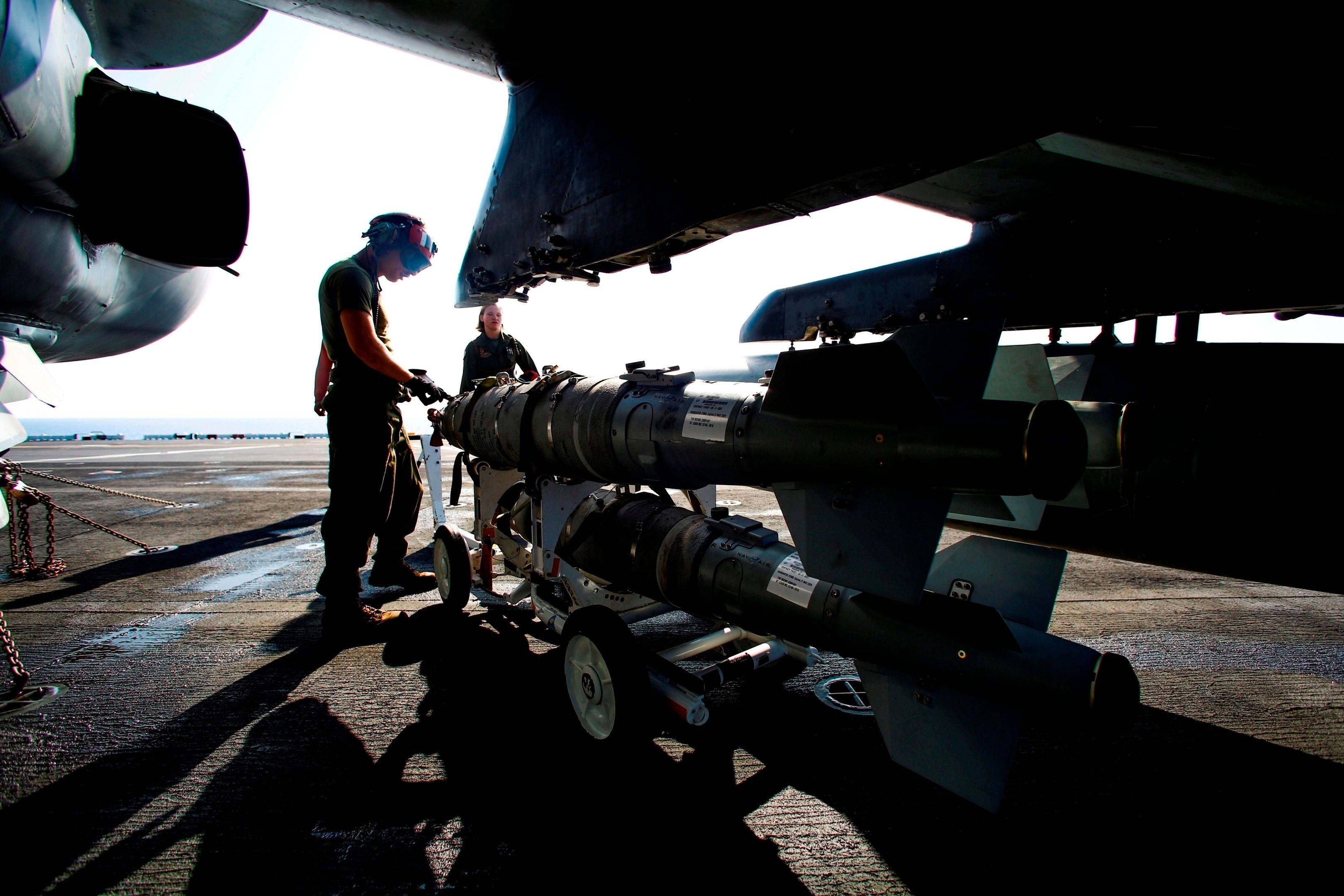 Marines from 22nd US Marine Expeditionary Unit load ordnance on an AV-8B Harrier II on the amphibious assault ship USS Wasp on Aug. 2nd 2016 (USMC/ Cpl. Ryan G. Coleman)