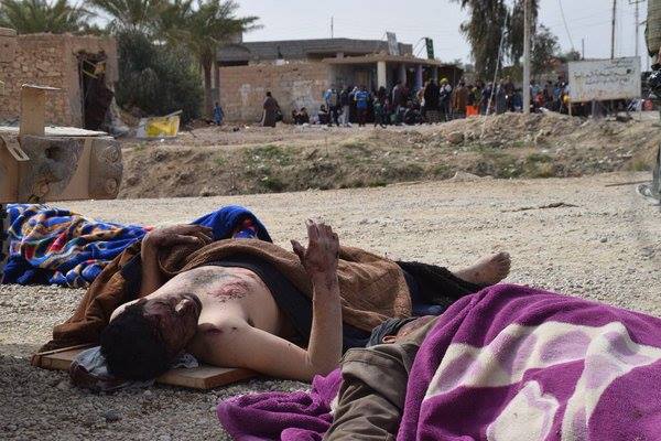 An image shows dead bodies on the floor after the alleged airstrike by coalition/Iraqi government.