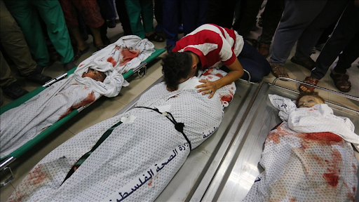 Loved ones mourn children killed in Israeli strikes on Al Shati camp on May 15th, 2021. (Image posted by Anadolu Agency)