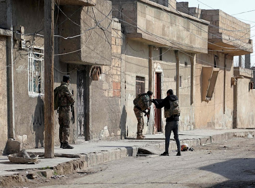 Kurdish security forces deploy in Syria’s northern city of Hassakeh amid ongoing fighting with Isis, 22 January 2022 (AFP via Getty )