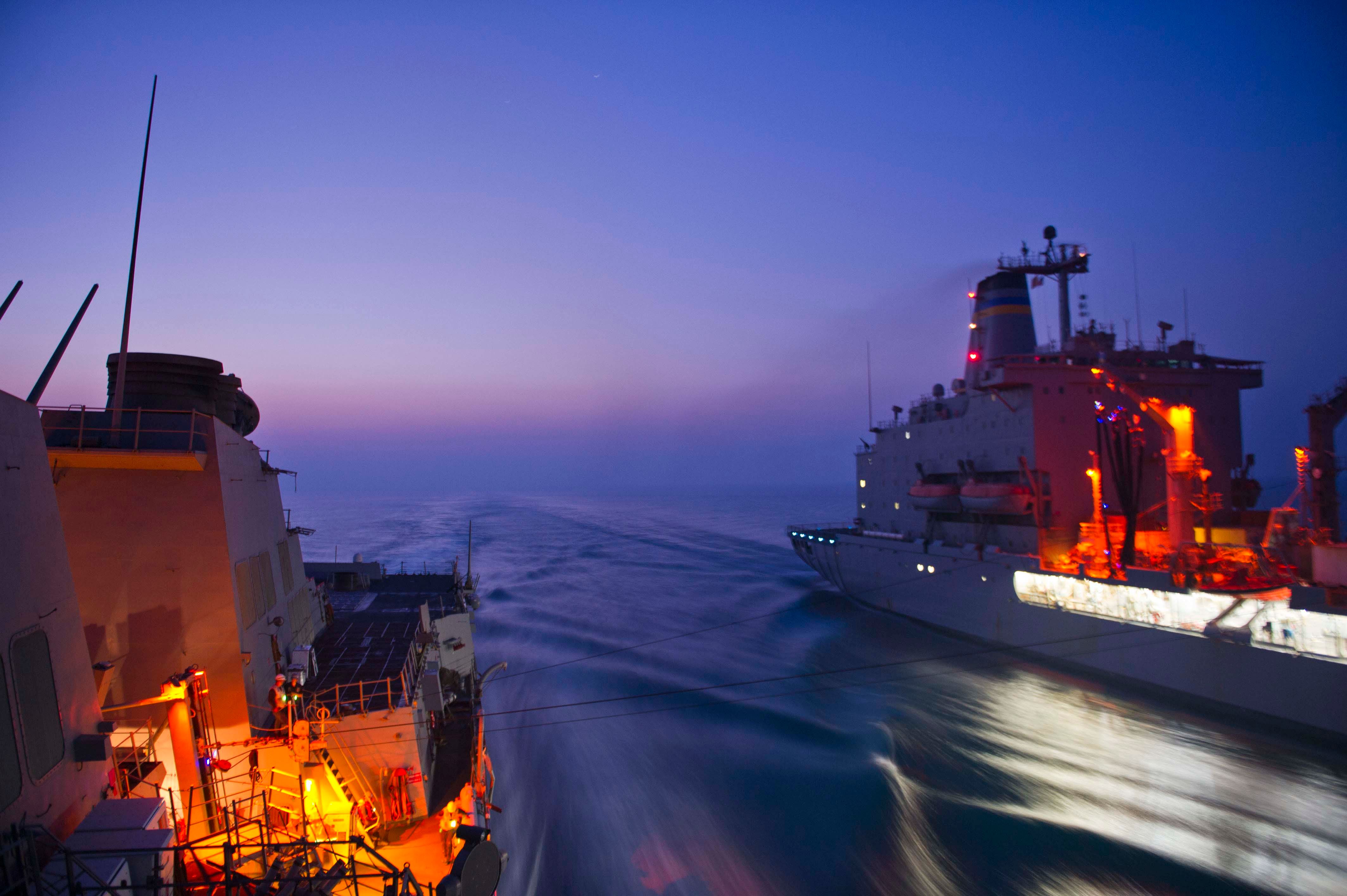 US guided missile destroyer the USS Winston S. Churchill replenishes supplies at sea - part of the large fleet working with the Coalition (US Navy/ Mass Communication Specialist 3rd Class Josh Petrosino)