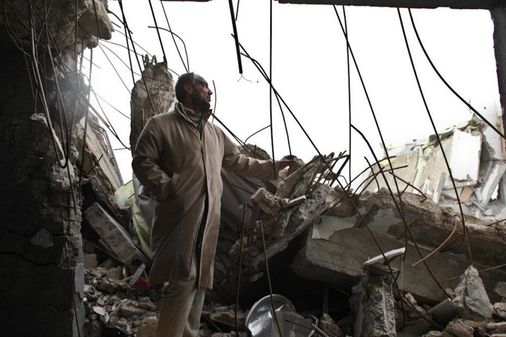 Mahmood Zarooq in the the home in Sirte after a NATO airstrike in 2011 (Human Rights Watch/Sidney Kwiram)