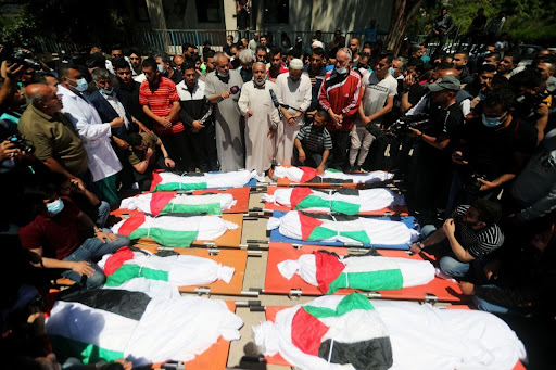 Funeral for the 10 women and children killed in Israeli strikes on Al Shati camp on May 15th, 2021. (Image posted by @RassdNews)