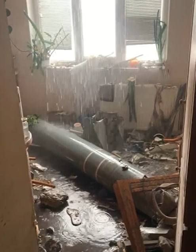 Image posted on Twitter by @_KA3AXCTAH indicating the remnants of the projectile in the residential home where a woman sustained injuries from alleged Russian actions.