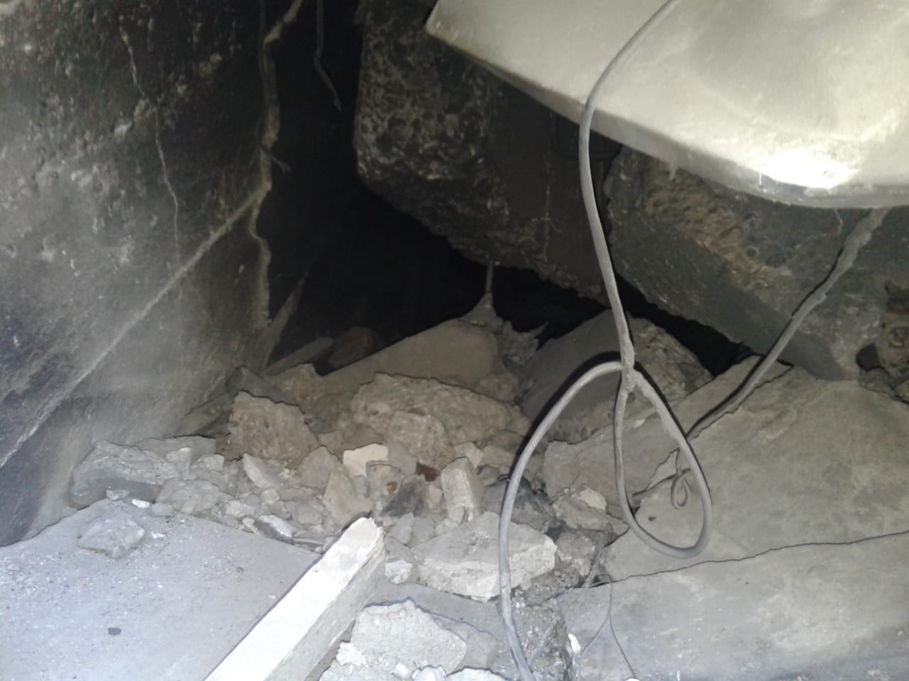 The hole from which survivor Kareema escaped between strikes on a Mosul family home (Image courtesy of the Al Saffar family.)