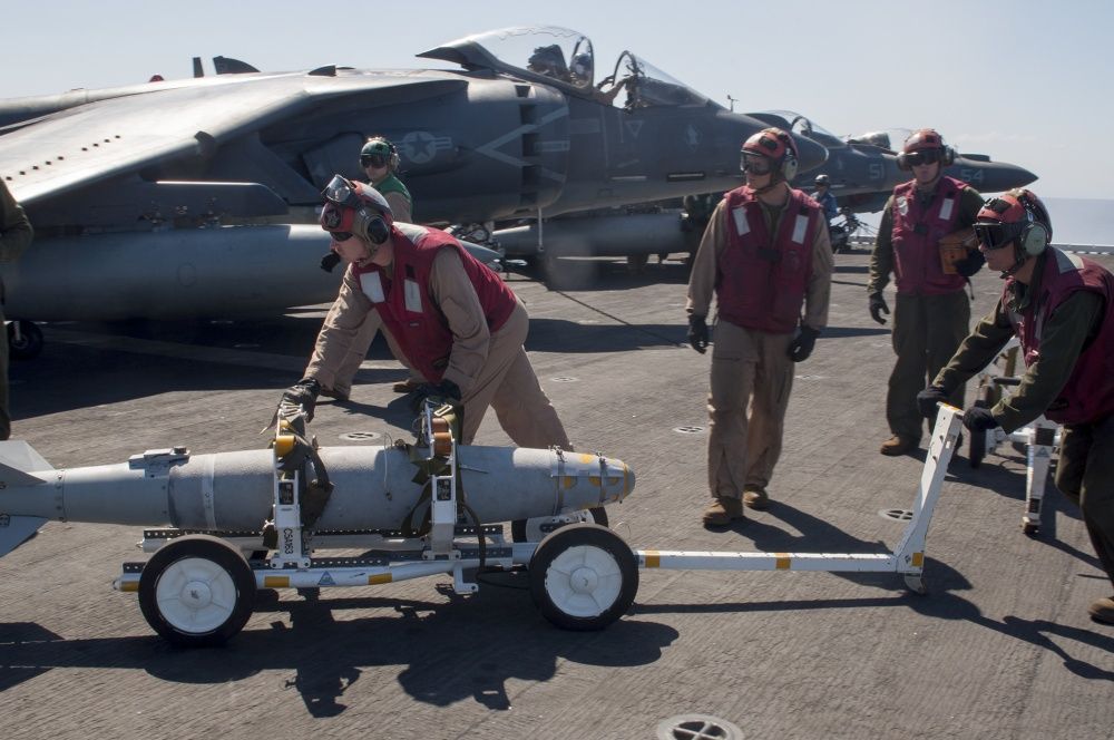 Ordnance is loaded onto an AV-8B Harrier aboard USS Wasp (US Navy)