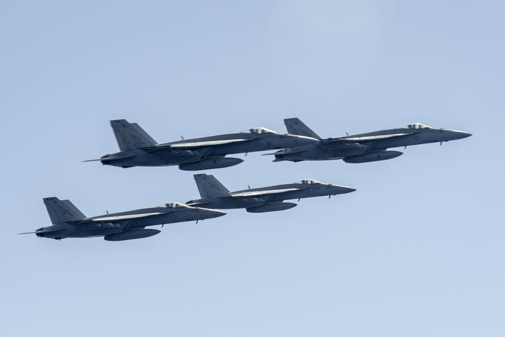  Four aircraft assigned to Carrier Air Wing 7 perform a fly-by off the port side of the aircraft carrier USS Harry S. Truman (CVN 75) [US Navy]