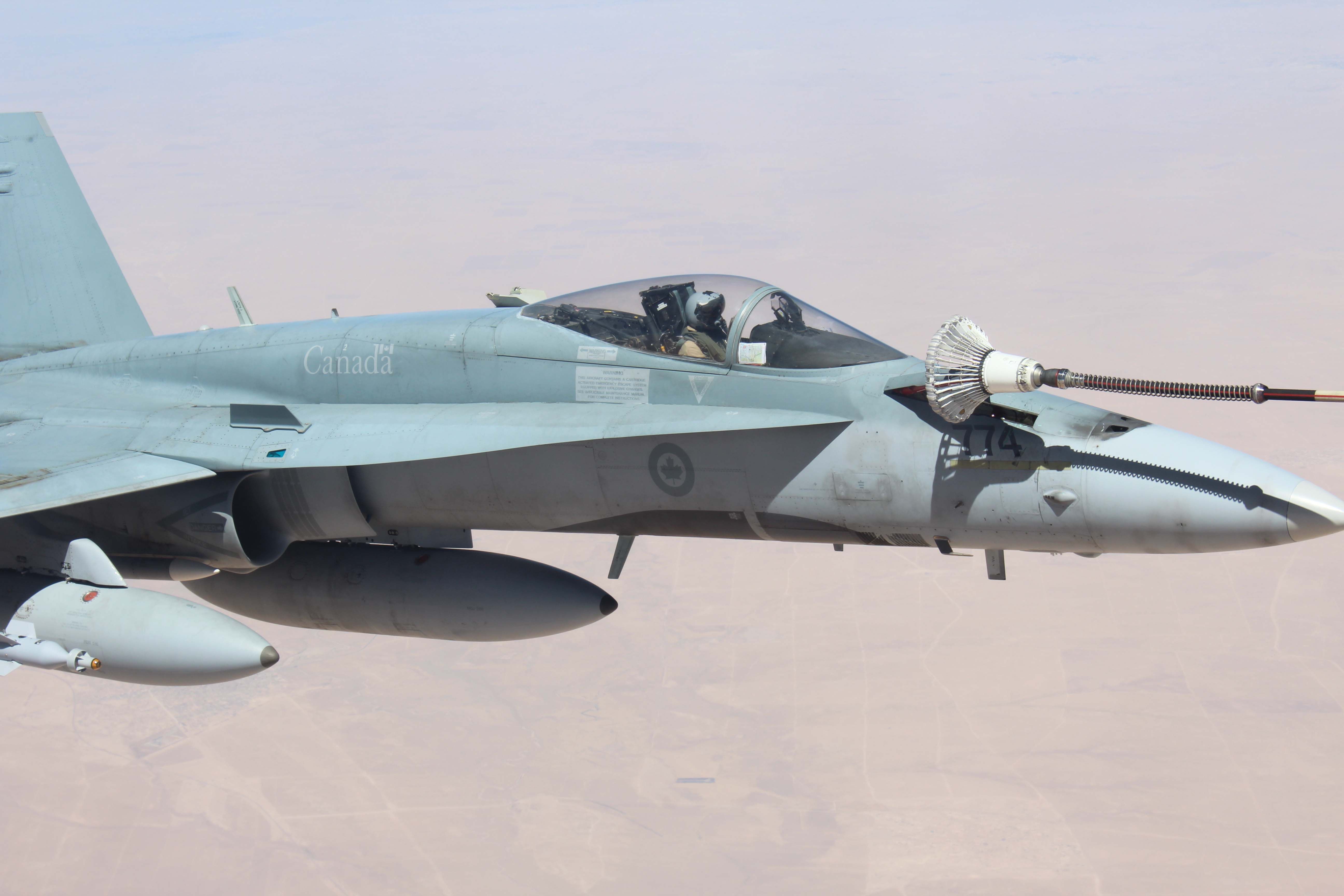 A Royal Canadian Air Force FA/18 receives fuel from an RAF Voyager tanker (UK MoD)