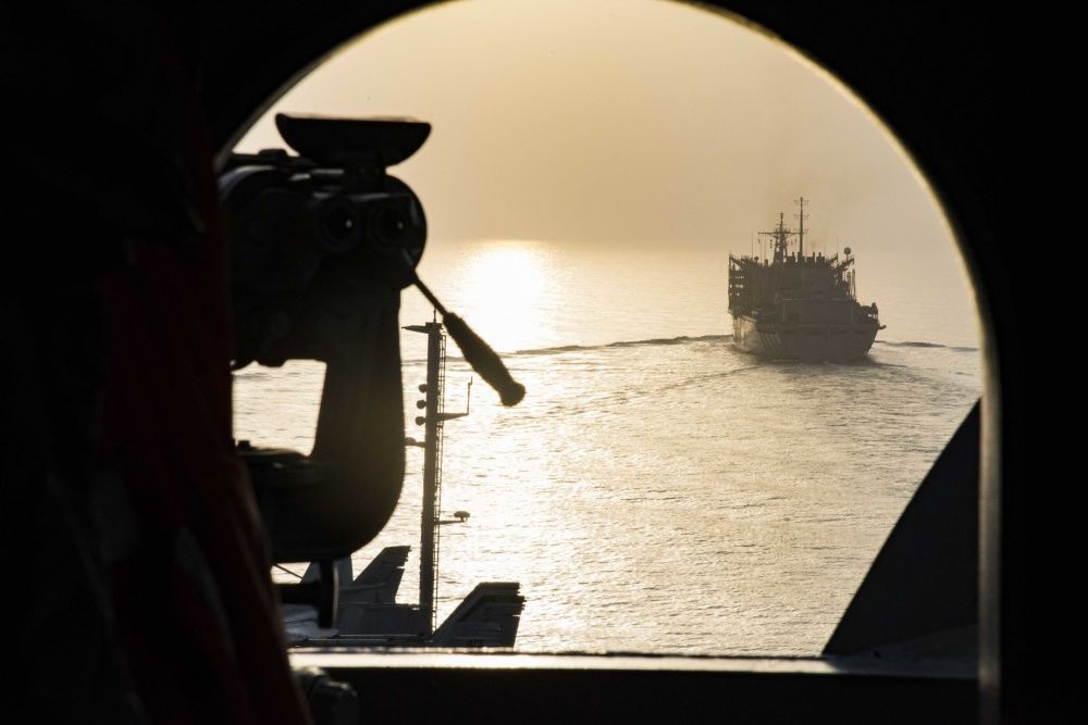 The aircraft carrier USS Dwight D. Eisenhower (CVN 69) (Ike) approaches the fast combat support ship USNS Arctic (T-AOE 8) to conduct a replenishment-at-sea (US Navy)