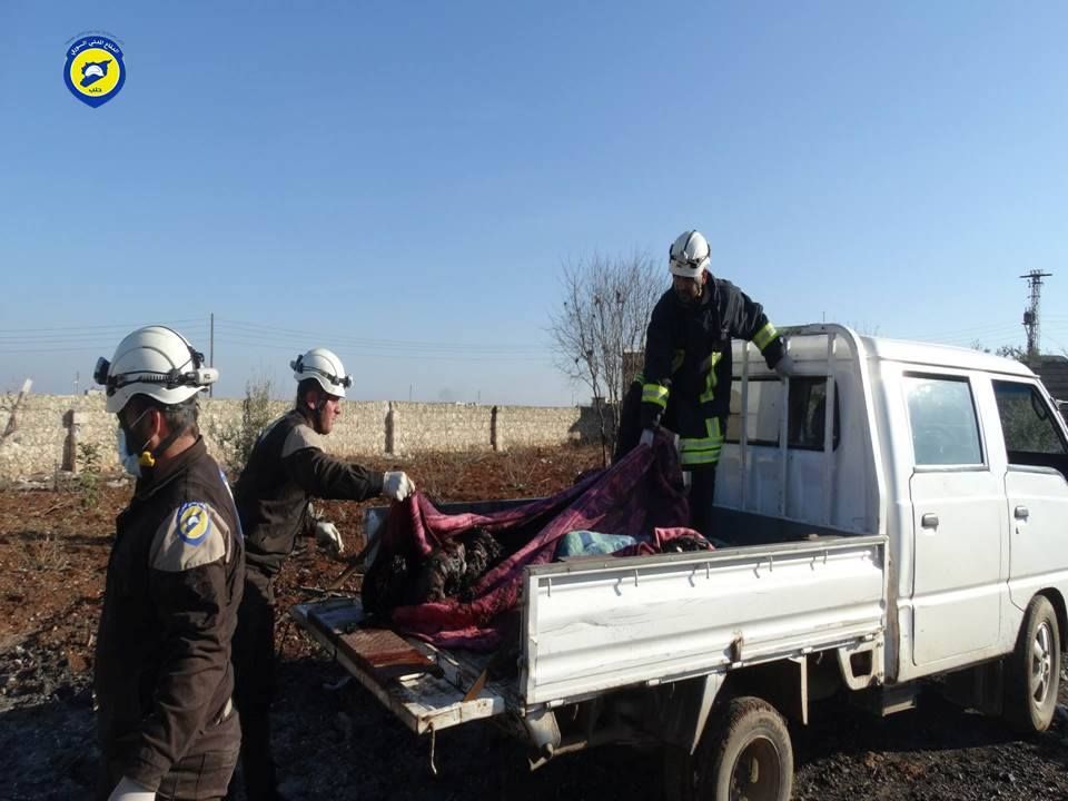 'The civil defence moving martyrs and wounded following raids by warplanes on the village of Ma’arasta Khan in the Northern Aleppo countryside.'
