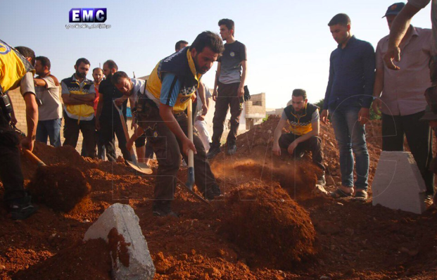 Syrian Civil Defense teams at the funeral of two of their colleagues who were killed in an alleged Russian double-tab airstrike on Khan Sheikhoun on June 26th (via Edlib Media Center).