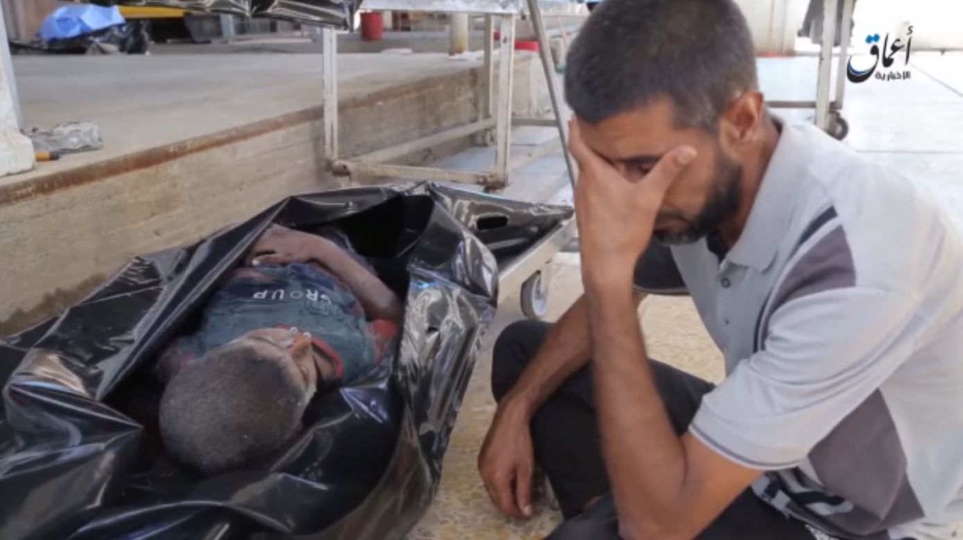 A father weeps next to his dead son, reportedly killed in a Coalition strike on Mosul, September 29th 2015 (via ISIL propaganda video)