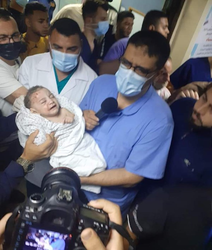 Image of baby Omar Al Hadidi, pulled from the rubble in critical condition following strikes on Al Shati camp on May 15th, 2021. (Image posted by Alnaba News)