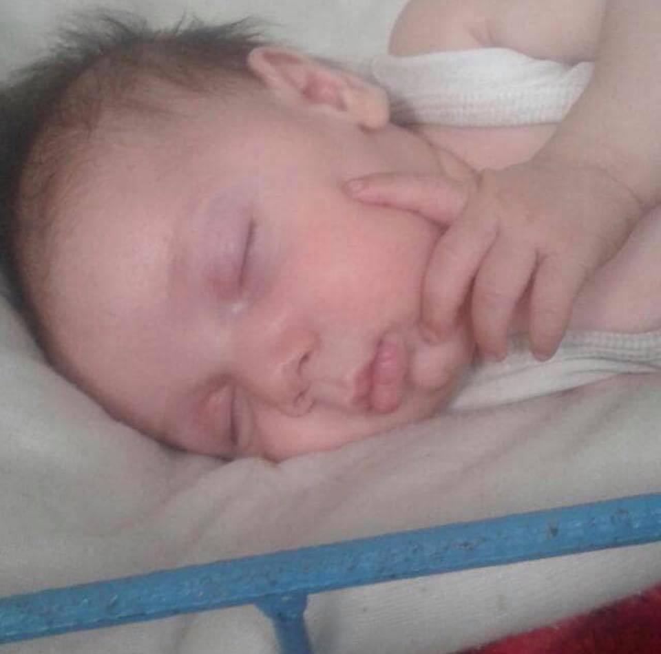 Child of Abdul Razzaq al-Jazzar, who was killed with his wife and children by an alleged Coalition airstrike on the city of Hajin (via Palmyra).