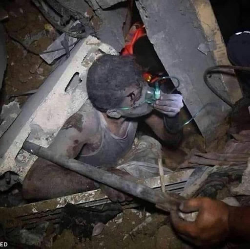 Rescue crews search through the rubble for survivors following strikes on Al Shati camp on May 15th, 2021. (Image posted by @omali3131)