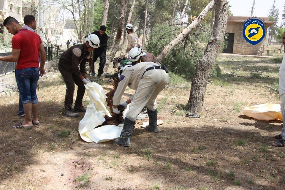 GRAPHIC: Members of the White Helmets salvage a body following a strike on Sakhour, April 24th (via White Helmets)