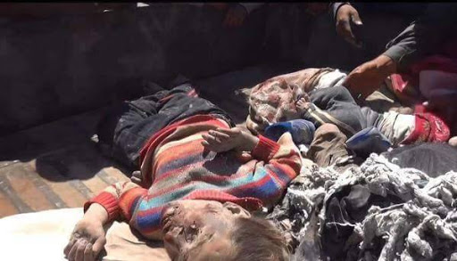 A series of stills from a video published by ISIS-affiliated media showing very graphic imagery of the dead a large proportion of them children. The video itself has been removed from youtube. [Via: SN4HR report published on May 6th 2015]