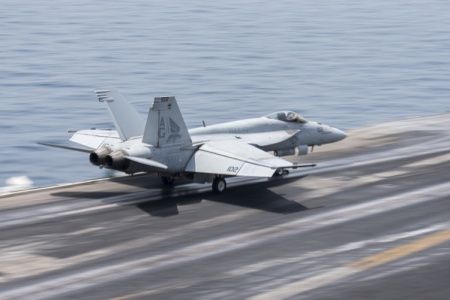An F/A-18E Super Hornet, assigned to the “Pukin’ Dogs” of Strike Fighter Squadron (VFA) 143, launches from the flight deck of aircraft carrier USS Harry S. Truman (US DoD)