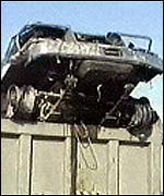 The BBC posted this unattributed image in November 2002. The caption reads 'The wrecked jeep was taken away for inspection.' (BBC, November 5th 2002)
