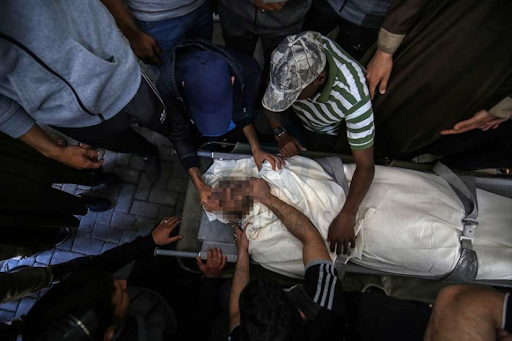 Body of the child identified as Ibrahim Al-Rantissi who was killed in strikes on Al Jeniya neighborhood on May 13, 2021. (Image posted by Anadolu Agency)