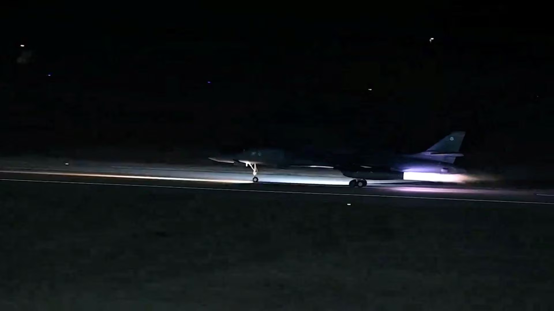 A plane takes off from an unidentified location, as the U.S. launches airstrikes on targets linked to Iran's Revolutionary Guard (IRGC) and the militias it backs, in the screen grab from a handout video released on February 2, 2024. US Central Command via X/Handout via REUTERS