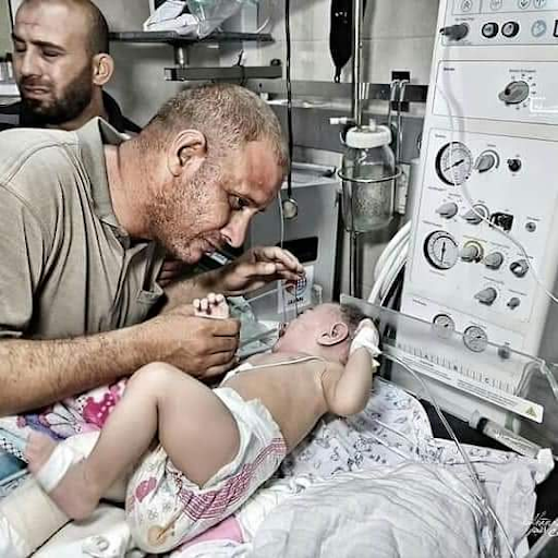 Father of baby Omar reunited with his child after his whole family is killed in Israeli strikes on Al Shati camp on May 15th, 2021. (Image posted by @Aboudwahidi)