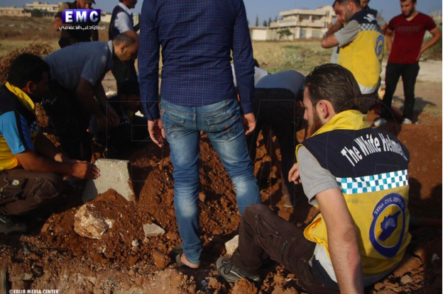 Syrian Civil Defense teams at the funeral of two of their colleagues who were killed in an alleged Russian double-tab airstrike on Khan Sheikhoun on June 26th (via Edlib Media Center).