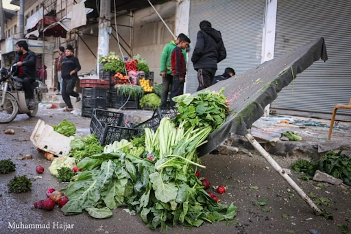 Blood covered market stalls and vegetable stands were turned over when a missile hit Al-Bab on February 2nd 2022 killing allegedly up to ten people (Image via @Gurbtwatan / Twitter)