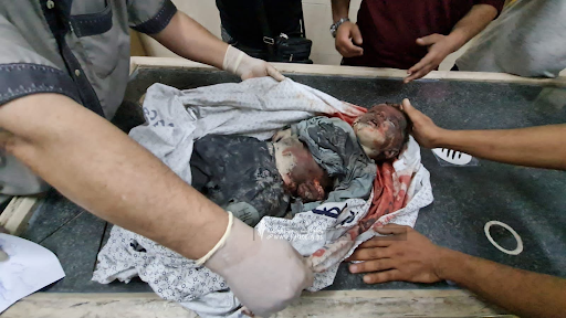 Very graphic image of a child allegedly killed in strikes on Al Jeniya neighborhood on May 13, 2021. (Image posted by Paltoday News)