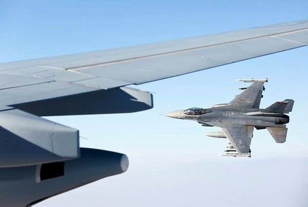 A 480th Fighter Squadron "Warhawks" F-16C flies alongside after refuelling from a KC-30A Multi-Role Tanker Transport air-to-air refuelling aircraft in the skies over the Middle East Region. (Aus MoD)