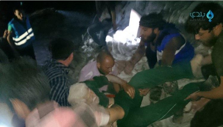 A man is pulled from the rubble after an alleged Russian airstrike on several Aleppo neighbourhoods, April 27th 2016 (via Baladi news)