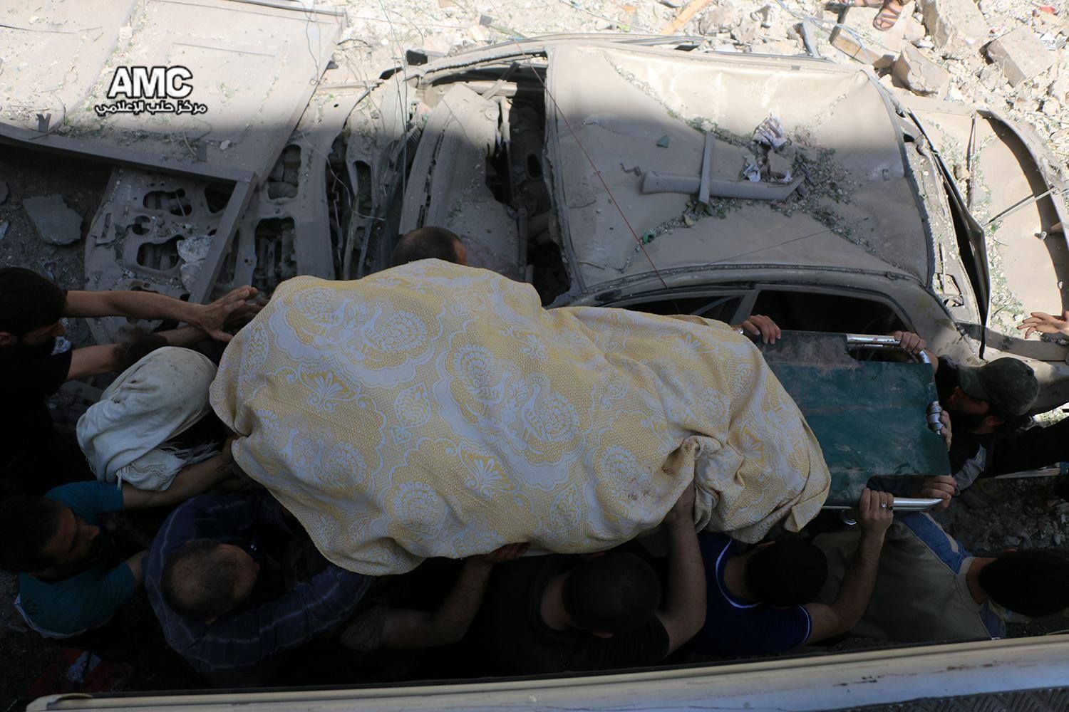 A victim is removed from the rubble following a strike on Bustan al Qasr, April 28th (via SN4HR)