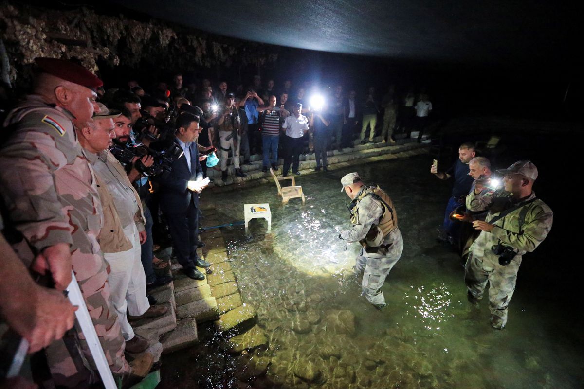 Abdul Ameer al-Shammari, deputy commander of Iraq's military Joint Operation Command and Iraqi Foreign Minister Fuad Hussein inspect the site of a Turkish attack on a mountain resort in Iraq's northern province of Dohuk, Iraq, July 20, 2022. REUTERS/Ari Jalal