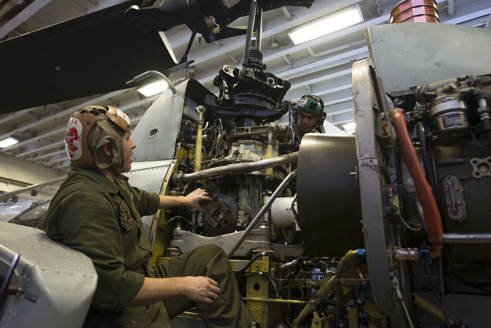Maintenance is performed on an AH-1W Super Cobra, Oct 3rd (US Navy)