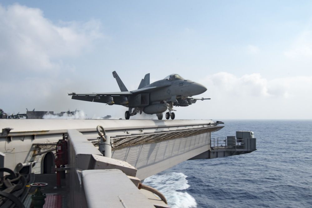 An F/A-18E Super Hornet assigned to the Sidewinders of Strike Fighter Squadron (VFA) 86 launches from the flight deck of the aircraft carrier USS Dwight D. Eisenhower (CVN 69) [US Navy]