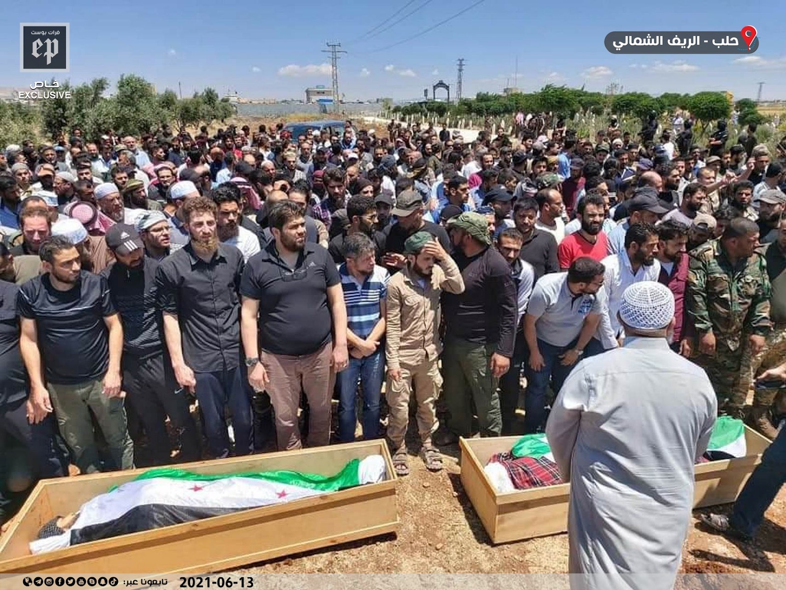 Image of mourners praying over the coffins of some of the victims killed in the bombing of Afrin on June 12, 2021. (Images posted by Euphrates Post)
