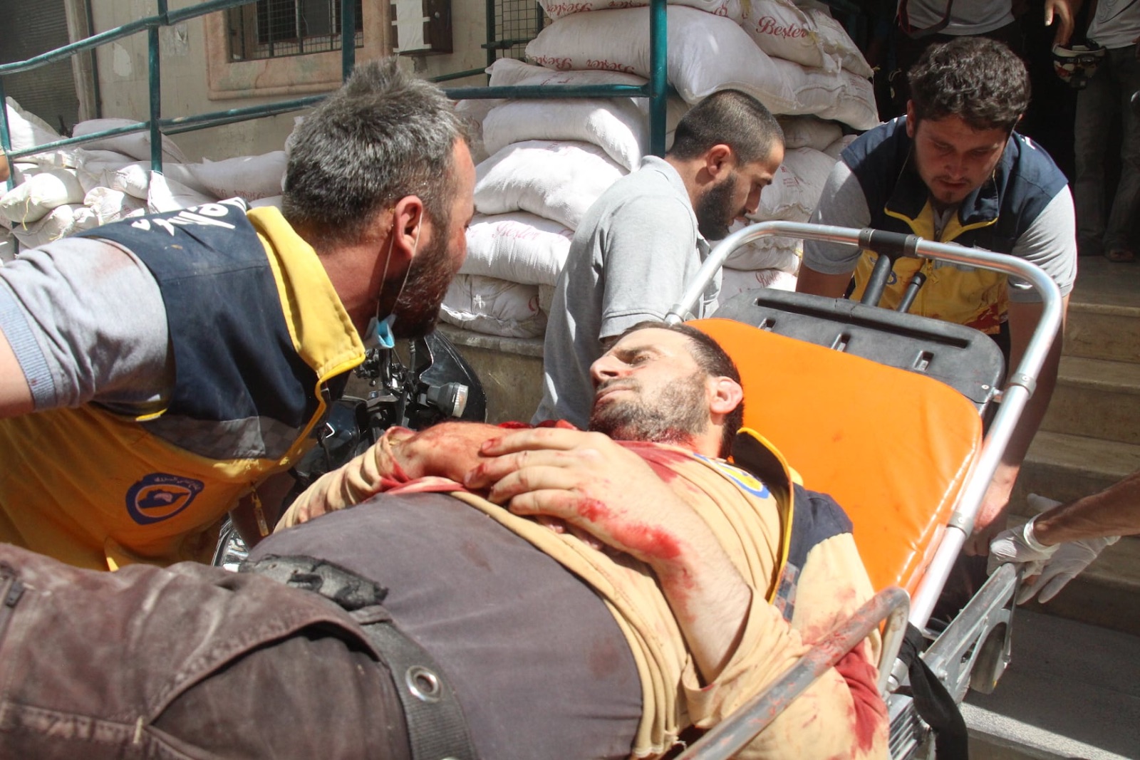 Injured Civil Defense member following a double strike on Sarja on July 17, 2021. (Image posted by Syrian Civil Defense)