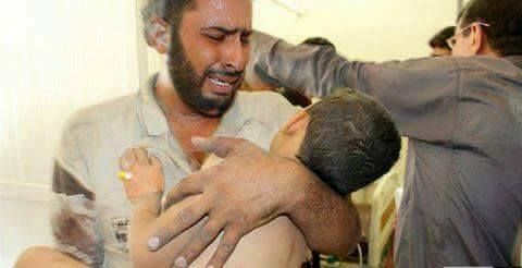 A man cradles a child casualty of an alleged Coalition strike at Hit, Oct 16th 2015 (via Iraqi Spring)