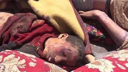 A series of stills from a video published by ISIS-affiliated media showing very graphic imagery of the dead a large proportion of them children. The video itself has been removed from youtube. [Via: SN4HR report published on May 6th 2015]