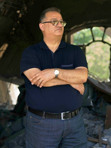 Basim Razzo, who survived a 2015 strike on his East Mosul home that killed his wife, his daughter, his brother and his nephew. (Image taken by Giles Price for The New York Times)