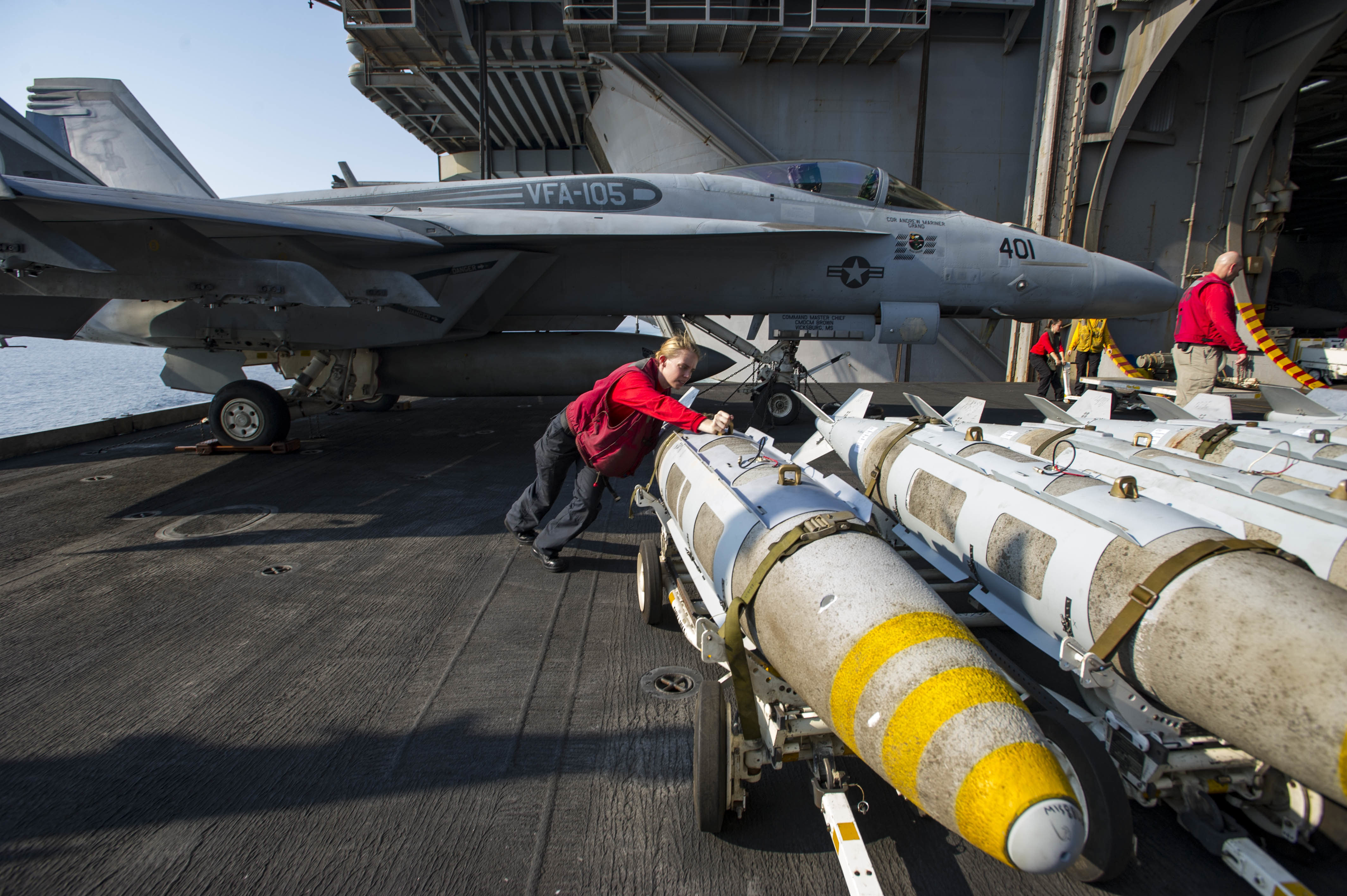 161027-N-WS581-348 ARABIAN GULF (Oct. 27, 2016) Petty Officer 3rd Class Ashley Wilson, from Macon, Mo., pushes a GBU31 bomb onto an aircraft elevator aboard the aircraft carrier USS Dwight D. Eisenhower (CVN 69) (Ike). Wilson serves aboard Ike as an aviation ordnanceman and is responsible for assembling and maintaining ordnance for the ship. Ike and its Carrier Strike Group are deployed in support of Operation Inherent Resolve, maritime security operations and theater security cooperation efforts in the U.S. 5th Fleet area of operations. (U.S. Navy photo by Petty Officer 3rd Class Andrew J. Sneeringer)